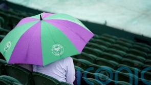 Rain makes early appearance as Wimbledon gets under way