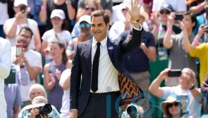 Centre Court gives Roger Federer standing ovation during centenary celebration