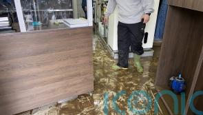 Firefighters rescue people from cars and homes as floods hit north-west