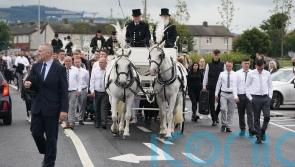 Funeral of three siblings who died in attack in home takes place
