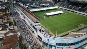 Pele to be buried today after lying in state at Urbano Caldeira stadium