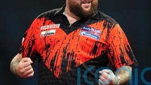 Michael Smith beats Dimitri Van den Bergh to move top of Premier League table