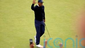 Tiger Woods finishes first round back with three straight birdies in California