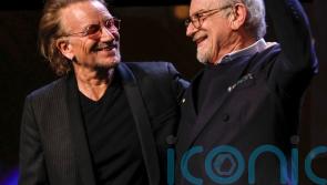 Bono presents Steven Spielberg with lifetime award at Berlin film festival
