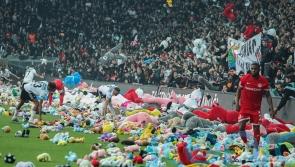 Besiktas fans throw toys onto pitch in support of those affected by earthquakes