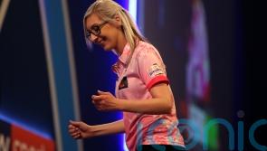 Fallon Sherrock becomes first woman to hit nine-dart finish in PDC event