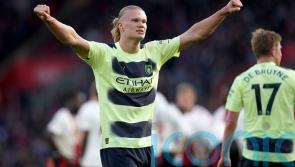 Erling Haaland strikes twice as Manchester City keep up title pursuit