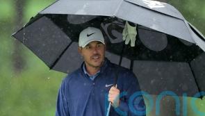 Masters suspended after heavy rain with Brooks Koepka leading the way at Augusta