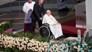 Pope celebrates Easter with big crowd in flower-adorned Vatican square
