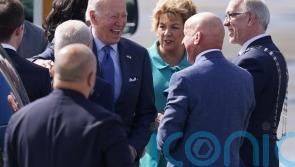 Joe Biden shares laugh with priest as he tours Catholic pilgrimage site