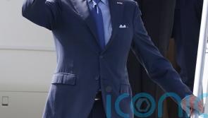 Biden looks at plaque in memory of late son and meets distant cousin at hospice