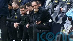 Cristian Stellini to console Davinson Sanchez after being jeered by Spurs fans