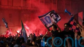 Napoli&rsquo;s fans light up the sky as they celebrate Serie A title win