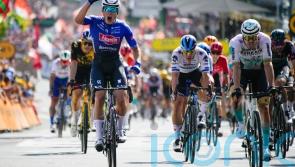 Jasper Philipsen sprints to stage three win as Adam Yates remains in yellow