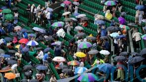 Tennis fans in macs and under umbrellas in queue for Wimbledon&rsquo;s middle Sunday