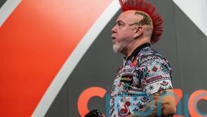 Peter Wright crashes out in New Zealand to truck driver Jonny Tata