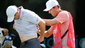 Rory McIlroy three behind lead despite muscle spasms leading into tournament