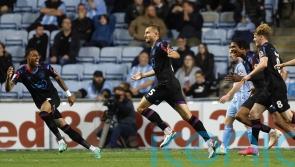 Late goal gives Darren Moore a draw in his first game as Huddersfield boss