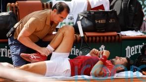 Novak Djokovic forced to withdraw from French Open with knee injury