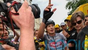 Jasper Philipsen holds off Wout Van Aert to win stage 13 sprint after late crash