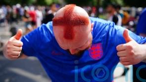 Barber who shaved St George cross into his hair among fans in Berlin