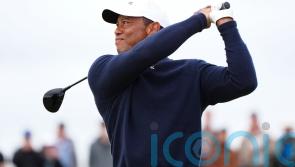 Struggling Tiger Woods set to miss Open cut as Shane Lowry moves into lead