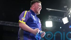 Luke Littler beats Michael Smith to win World Series of Darts Finals
