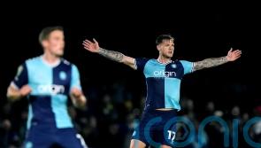 Early goal sees leaders Wycombe to win over Wigan