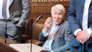 Politician who stuck two fingers up to opposition claims he was provoked