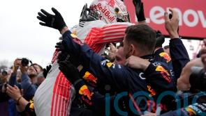 Max Verstappen wins Japanese Grand Prix after pit-lane tussle with Lando Norris