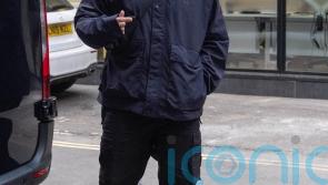 Kneecap star arrives at show with tape over mouth a day after terror charge