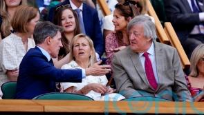Sir Stephen Fry and Ellie Goulding lead famous faces in Wimbledon Royal Box