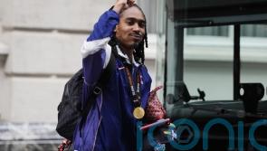 Djed Spence signs new contract at Tottenham