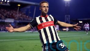 Grimsby hang on after 10-man MK Dons stage second-half fightback