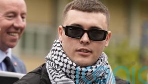 Prosecutors appeal against decision to dump terror case against Kneecap rapper