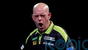 Michael van Gerwen survives scare to reach World Championship second round