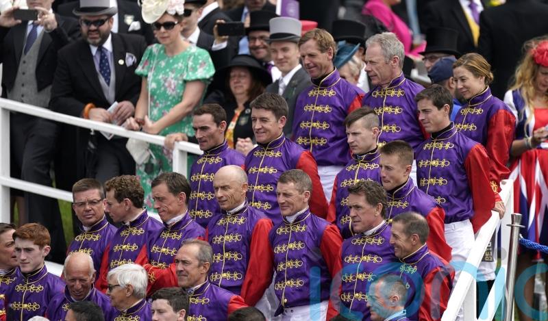 Spectacular sight at Epsom as Queen&rsquo;s jockeys form guard of honour