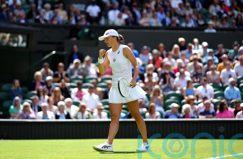 Iga Swiatek extends winning run to 36 matches with first-round Wimbledon success