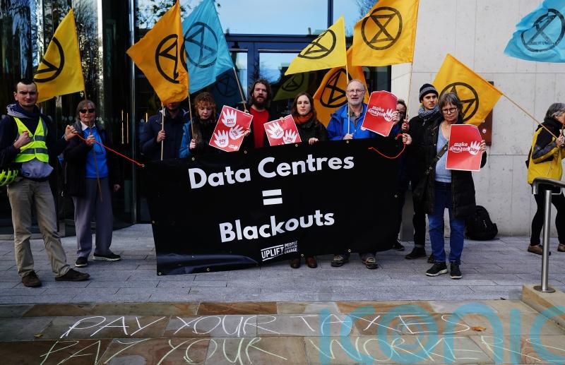 Crowd gathers at Amazon&rsquo;s European HQ as part of worldwide Black Friday protest