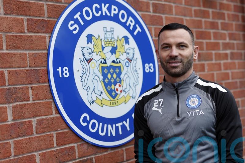 Phil Bardsley signs for Stockport and donates his wages to charity