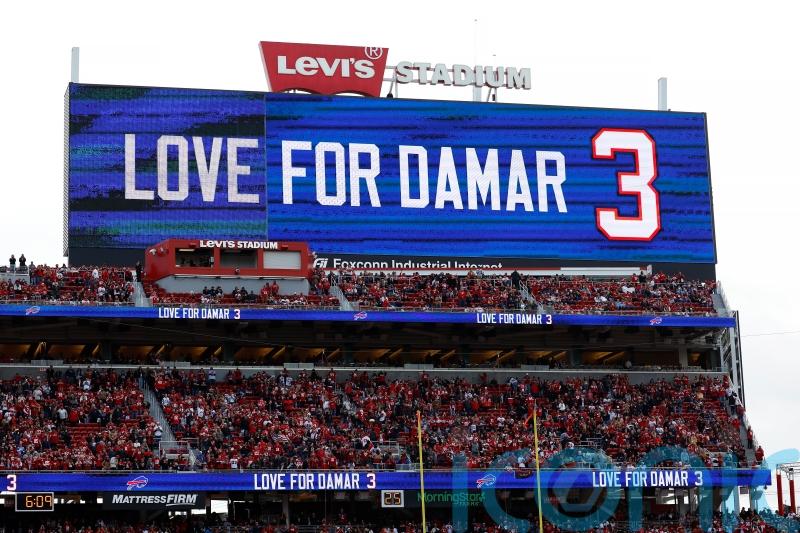 Damar Hamlin remains in hospital but &lsquo;is in good spirits&rsquo; after cardiac arrest