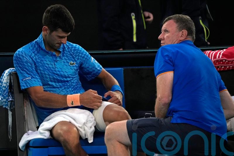 Novak Djokovic plays through the pain to beat Grigor Dimitrov at Australian Open