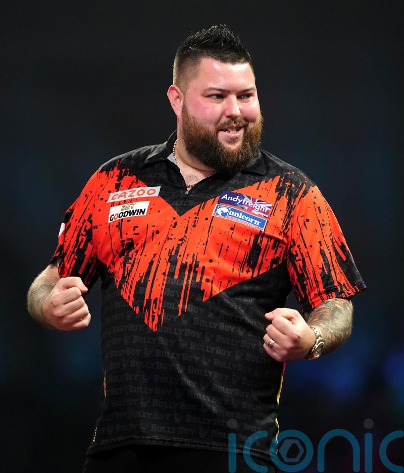 Michael Smith beats Dimitri Van den Bergh to move top of Premier League table