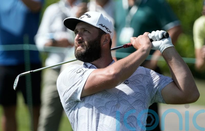 Jon Rahm shoots course record as title defence hots up