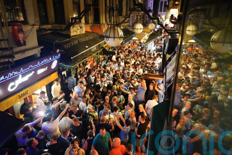 Manchester City fans take over streets of Istanbul with flares and chants