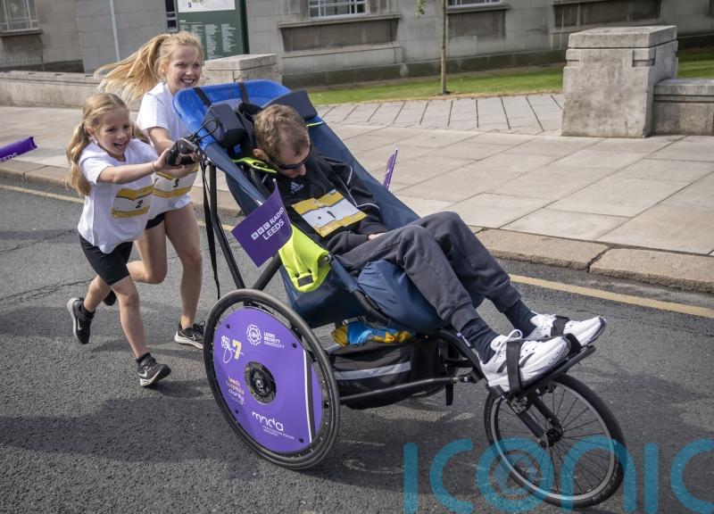 Rob Burrow pushed around Leeds fun run course by daughters on Father&rsquo;s Day