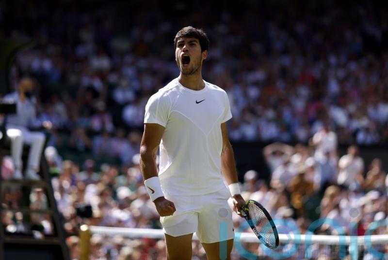 Top seed Carlos Alcaraz battles into third round at Wimbledon