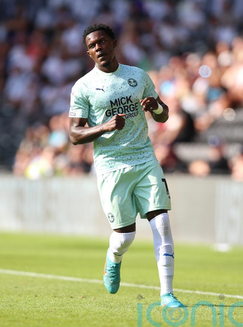 Peterborough fend off 10-man Blackpool&rsquo;s fightback to climb up to fourth