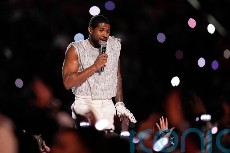 Usher performs medley of hits at Super Bowl half-time show beside special guests