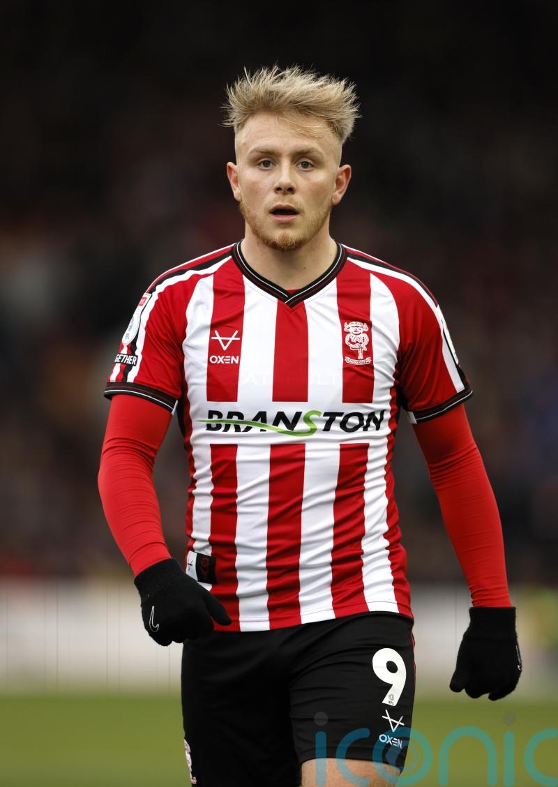 Lincoln batter Cambridge to maintain long unbeaten run and play-off push